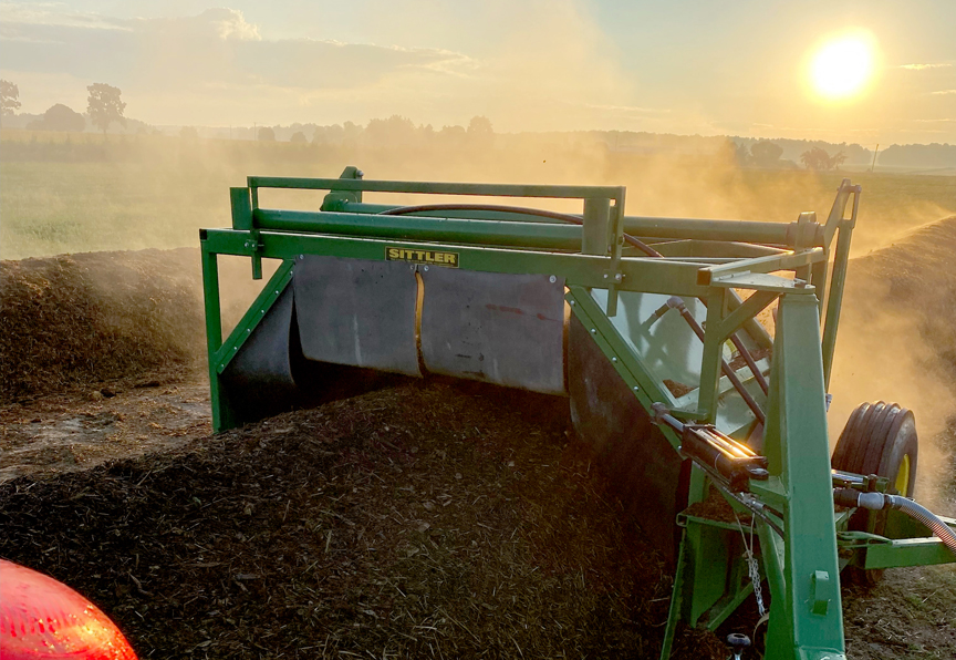 Global Repair compost turner 509 with sunset